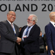 Heads of delegations cheer an end to a grueling series of climate negotiations in Katowice.